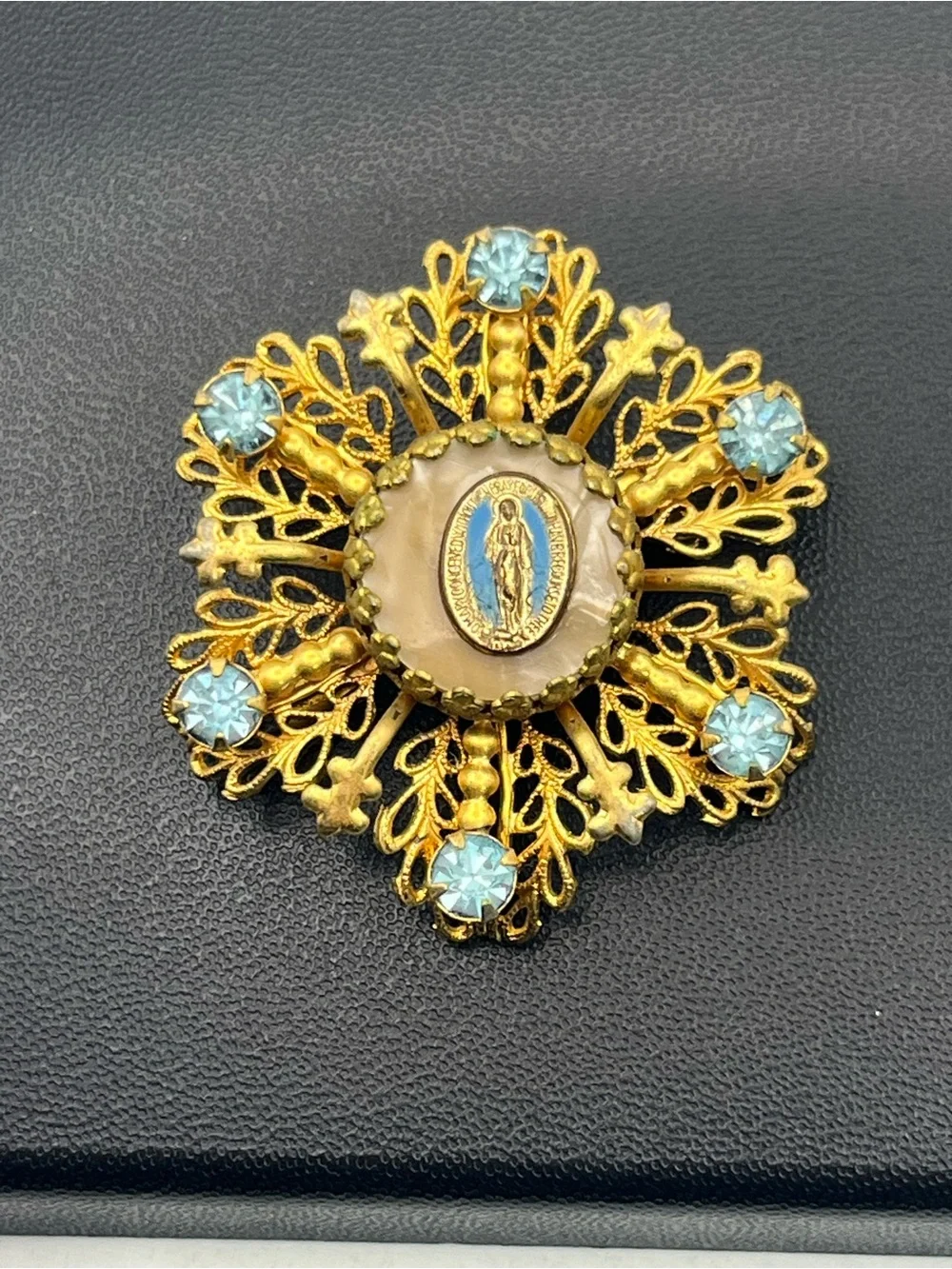 Miraculous medal Catholic Virgin Mary blue rhinestone gold tone starburst brooch